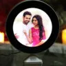 Round-shaped magic photo mirror that reveals a personalized photo when illuminated, serving as both a stylish mirror and a unique decorative piece, perfect for gifting on special occasions.